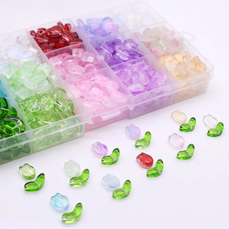 A clear plastic box filled with various colored gradient glass beads for jewelry making
