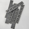A collection of gray replacement keyboard contact strips for Yamaha digital pianos.