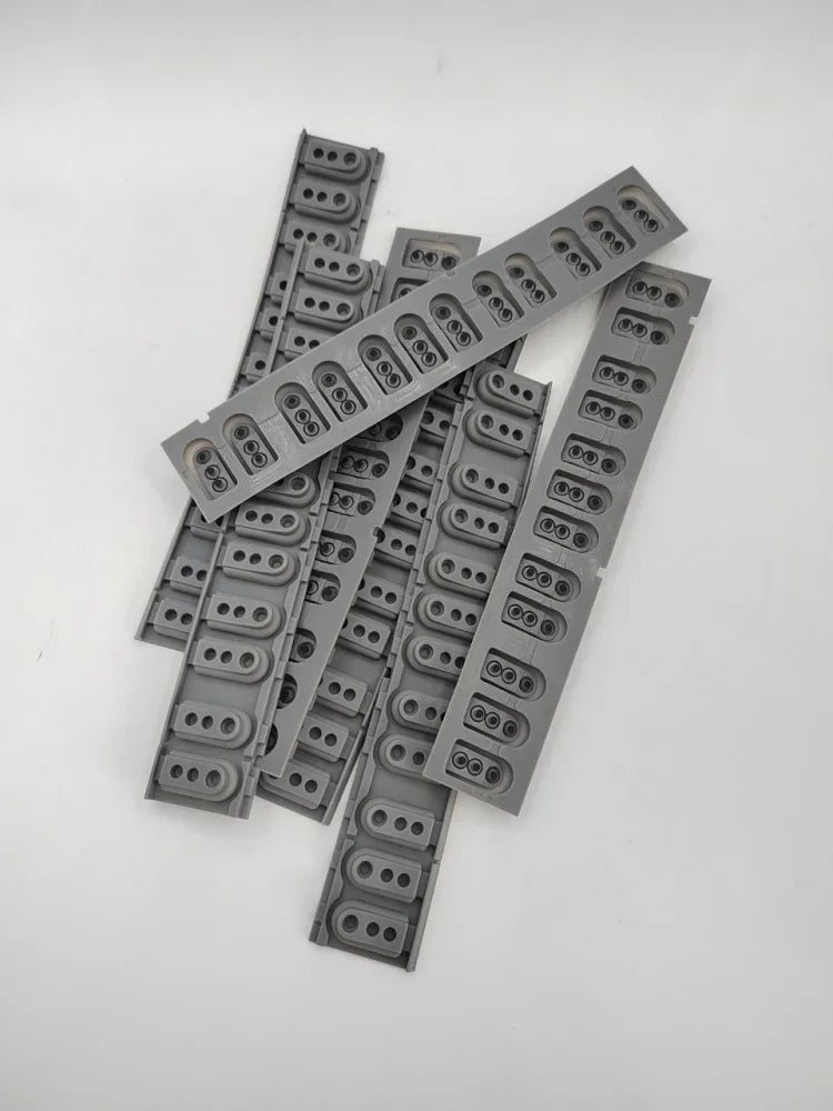 A collection of gray replacement keyboard contact strips for Yamaha digital pianos.