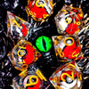 A collection of resin dice featuring a spinning dragon eye core, set against a dark, textured background.