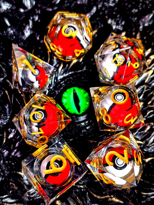 A collection of resin dice featuring a spinning dragon eye core, set against a dark, textured background.