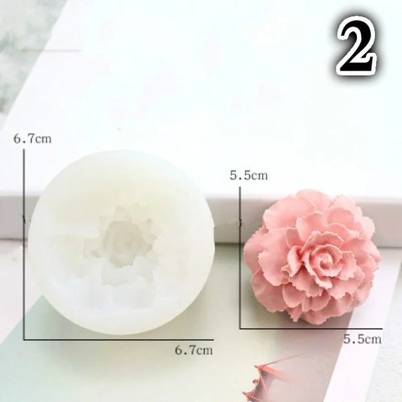 A white silicone mold shaped like a flower, used for decorating soap, candles, or cakes.