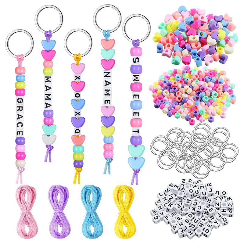 A collection of heart-shaped DIY beaded keychain kits featuring various letter charms in multiple colors.