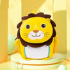 A yellow lion-themed backpack with dark brown fur and a white chest, sitting on a light wooden surface.