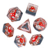 A set of translucent, red and clear polyhedral dice shaped like mushrooms for tabletop role-playing games
