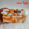 A rectangular bar of orange and white marbled butter, labeled 4oz Butter, shown against a white background.