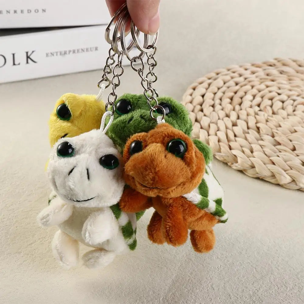 A set of adorable turtle plush keyrings with green and yellow coloring hanging from metal chains.