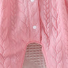 Pink quilted baby girl romper featuring a lace collar and button details.