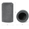 A cylindrical piece of dark gray flocked foam used as a microphone windscreen cover.