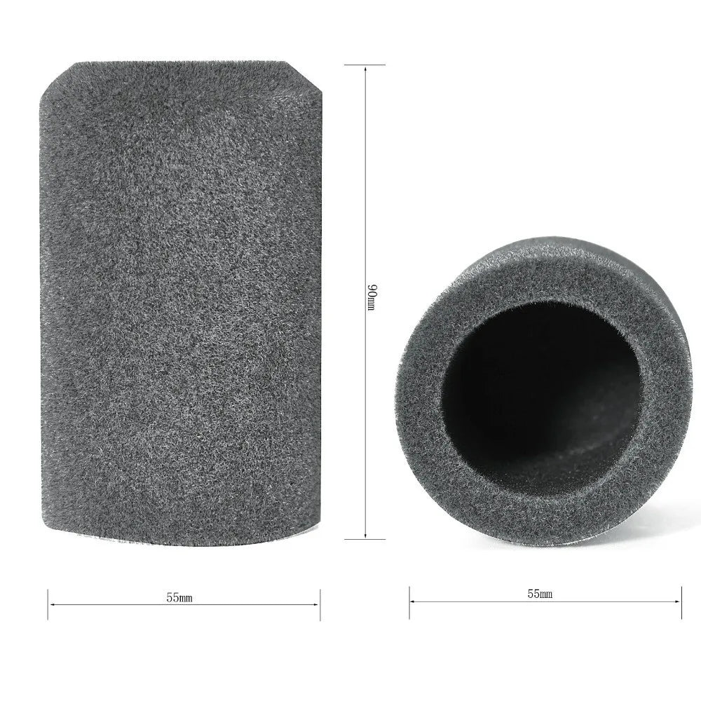 A cylindrical piece of dark gray flocked foam used as a microphone windscreen cover.