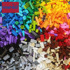 A bulk set of colorful building blocks in various colors including green, blue, yellow, orange, and pink.