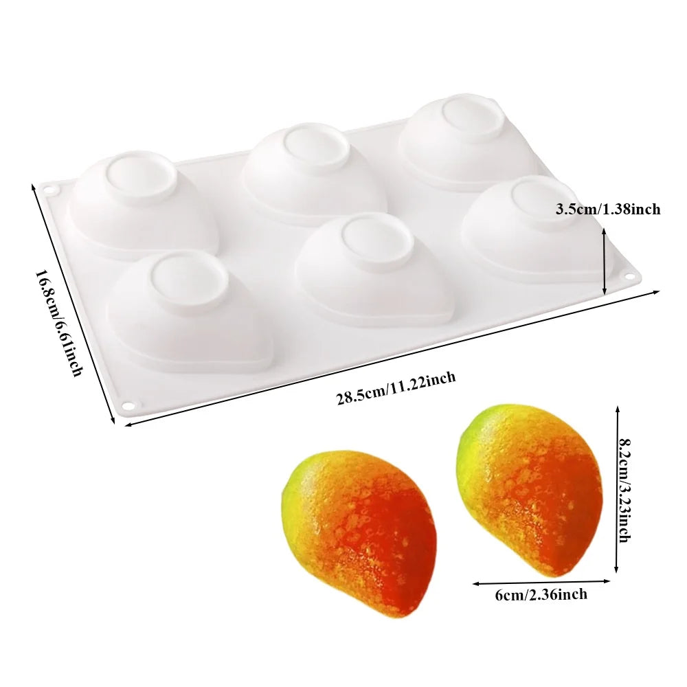 A white silicone mold with multiple fruit shapes for baking and desserts
