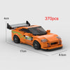 An orange classic supercar model built from LEGO bricks, shown in a side view.