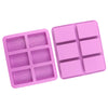 A pink silicone soap mold with six square cavities for DIY soap making