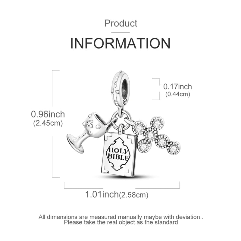A silver heart charm pendant with a religious text inscription is shown against a white background.