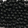 A pile of small, black, natural wooden beads for jewelry making and DIY crafts.