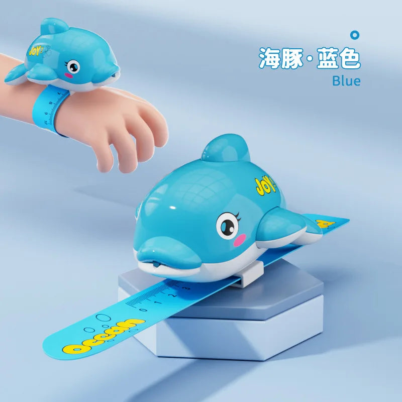 A blue turtle-shaped water gun is shown next to a measuring tape, demonstrating its use for splash fun.