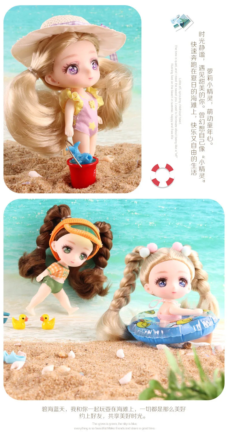 A small doll with brown hair wearing an orange hat and green outfit standing on a sandy beach.