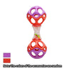 A colorful soft rubber teething and grasping rattle toy with purple and orange rings and a clear section containing small toy