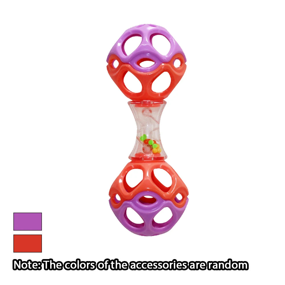 A colorful soft rubber teething and grasping rattle toy with purple and orange rings and a clear section containing small toy
