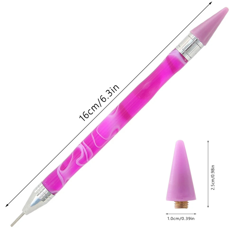 A long, pink double-head diamond painting pen with a wax tip shown diagonally.