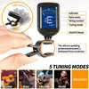 A clip-on electronic tuner with multiple tuning modes for guitar, bass, ukulele, and violin, shown being used on a fretboard.