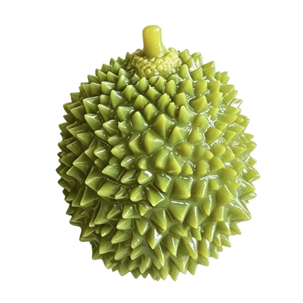 A green durian fruit with spiky skin and a yellow stem.