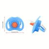 A light blue silicone feeding bottle set with an orange pacifier and a blue toy component.