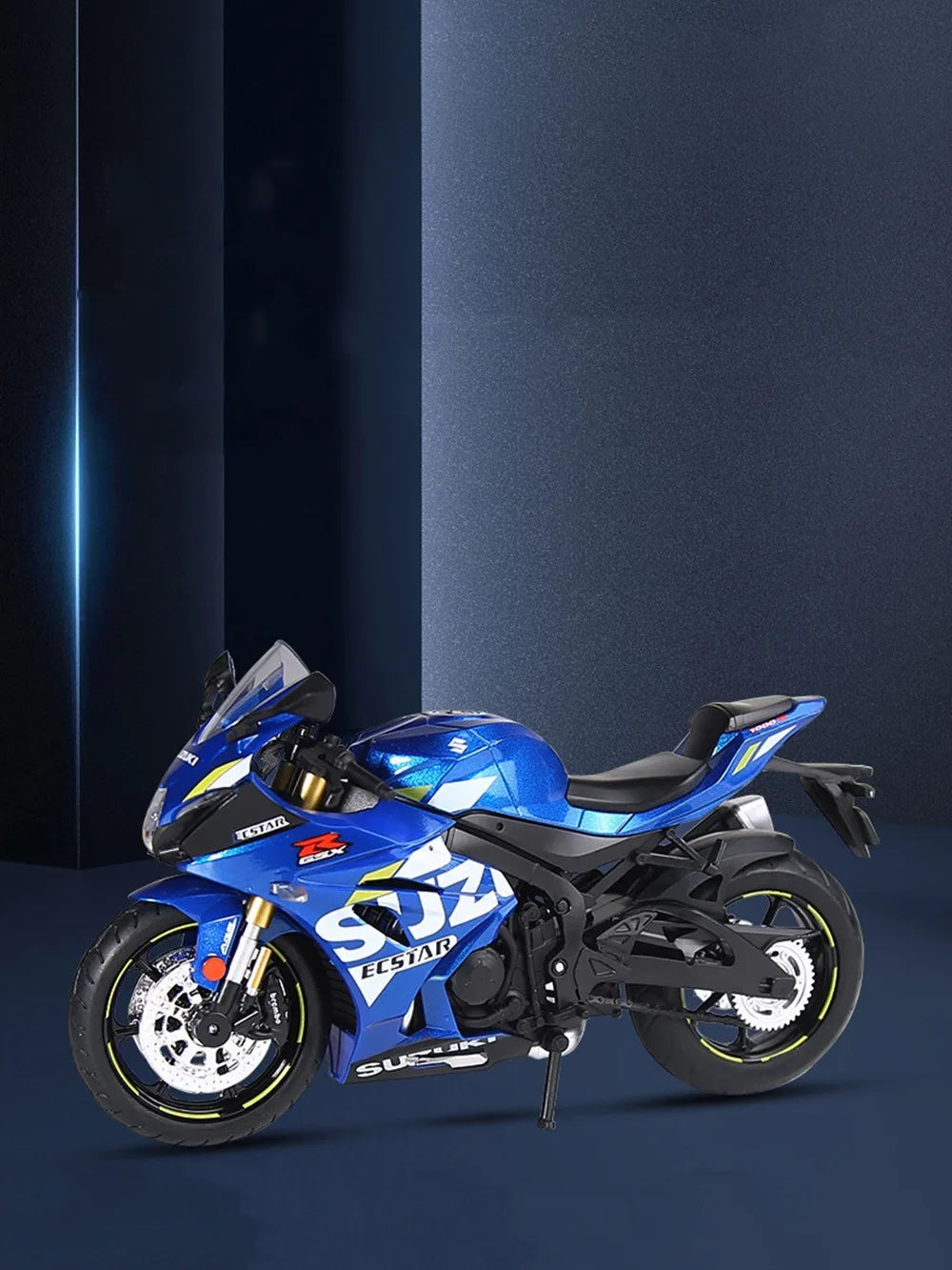 A blue Suzuki Eostar diecast motorcycle model with lights and suspension on a dark background.