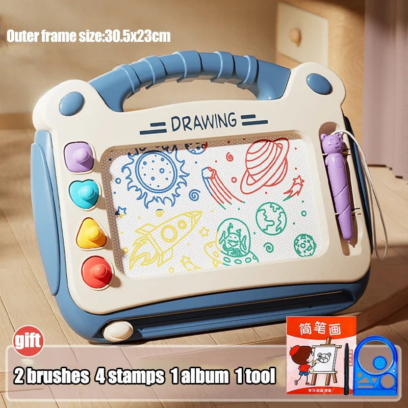 A light blue and white magnetic drawing board for kids with brushes, stamps, and an album.