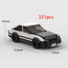 A black and white classic supercar model built from 331 plastic pieces.