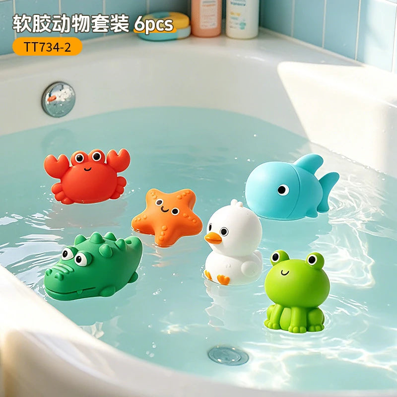 Six plastic turtle bath toys in orange, blue, and green floating in a bathtub.