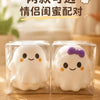 Two white squishy ghost stress balls packaged in clear plastic for gift delivery