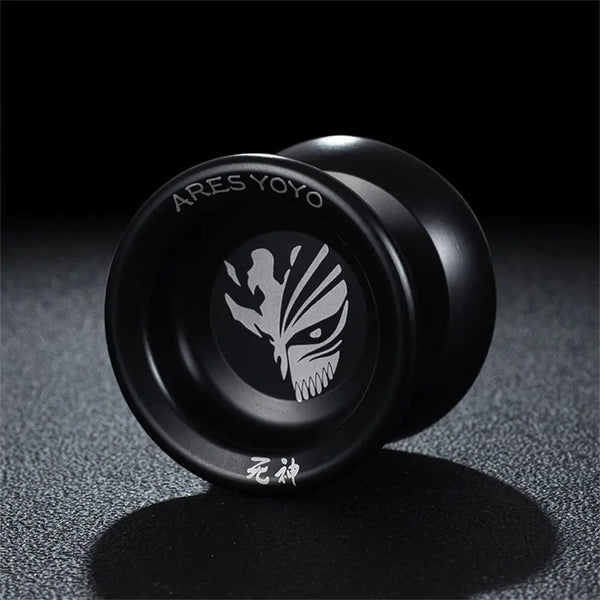 A black high-performance aluminum yoyo with a stylized tiger head design is shown against a dark background.