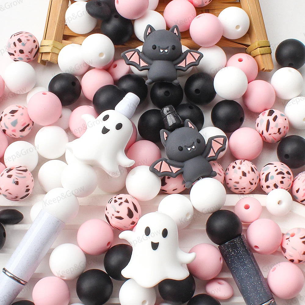 A collection of various colored and textured silicone crafting beads arranged on a wooden tray.