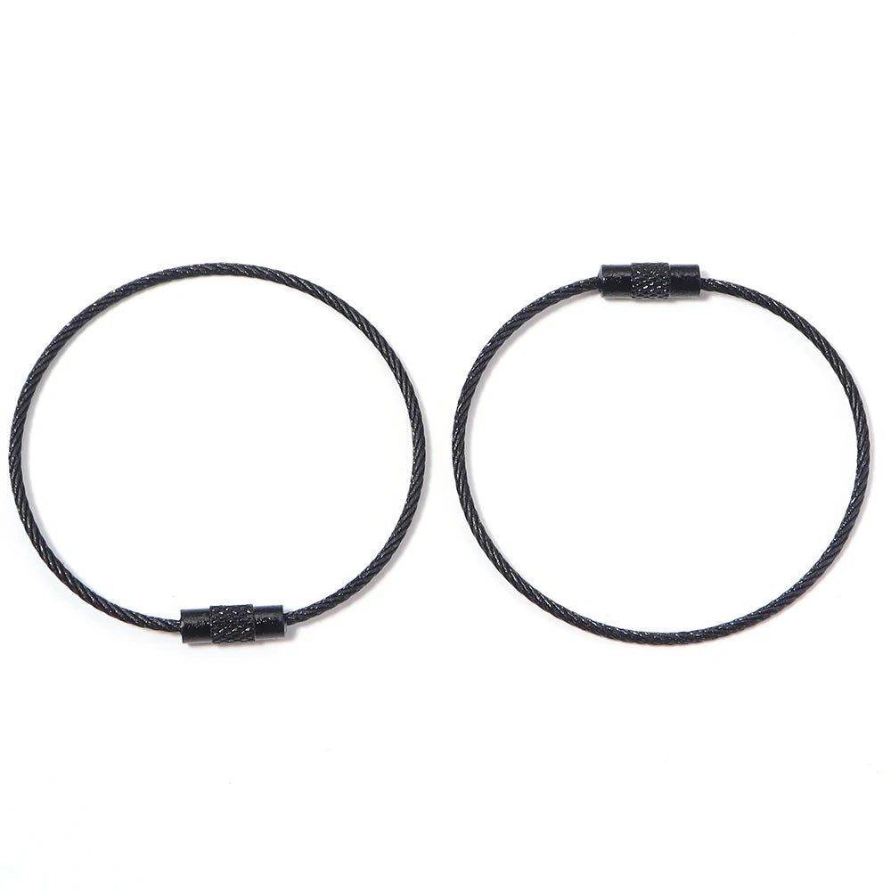 A pair of black stainless steel wire keychain rings with screw locks.