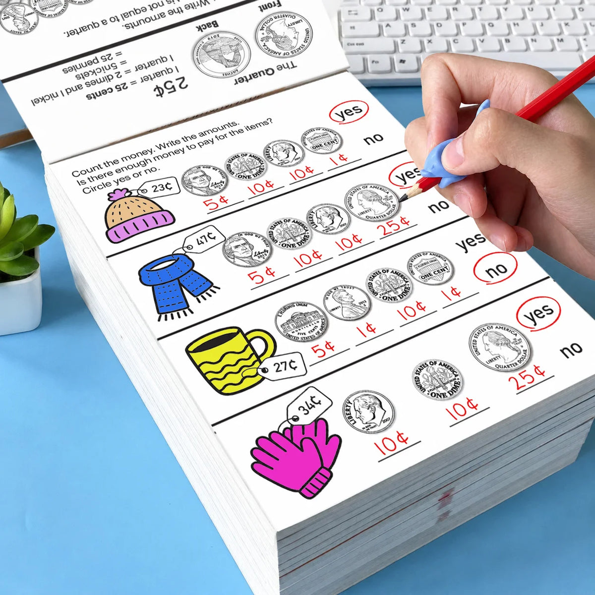 A hand is writing on a money counting activity workbook showing coin recognition and basic math problems.