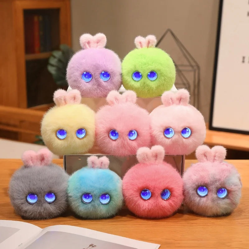 A collection of colorful plush rabbit pendants in lavender, lime green, yellow, pink, and blue hues.