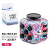A colorful fidget cube with a floral design and magnetic buttons is shown next to its packaging.