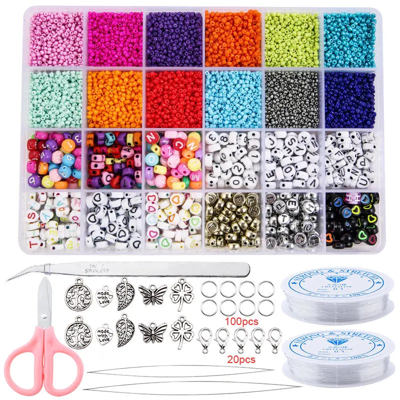 A variety of colored glass seed beads and jewelry making tools including pliers and storage containers.