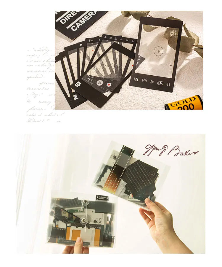 A hand holds a sheet of scrapbook stickers and paper for DIY crafts, with other related materials visible.