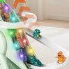 A white electric dinosaur race track toy featuring dinosaurs with lights and music.