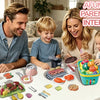 A family is playing with a kids pretend play kitchen set featuring various fruits, vegetables, and cookware.