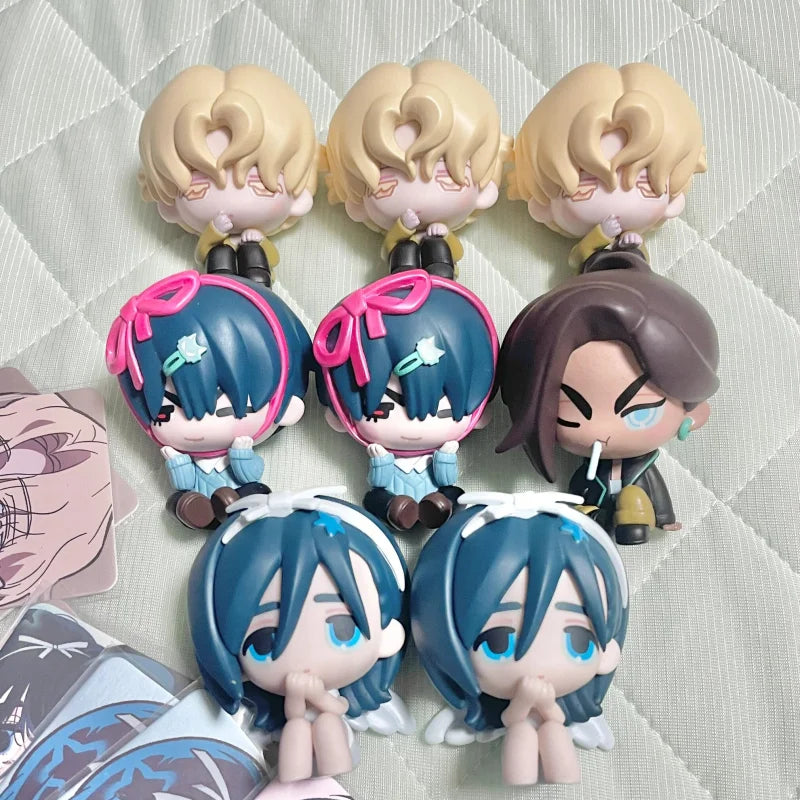 A collection of blind box figures featuring characters with light blonde hair and dark hair, displayed on a white surface.