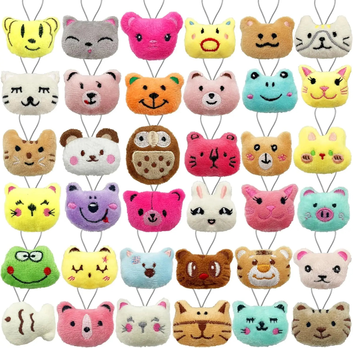 Assorted mini animal plush toys in various colors and textures with keychain loops