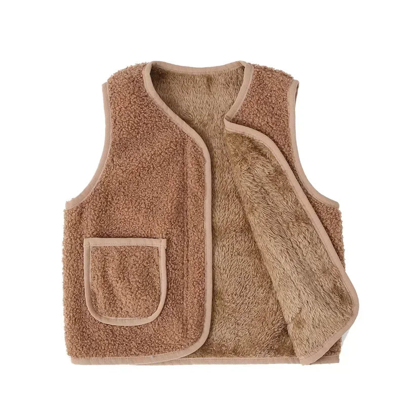 A beige fuzzy lamb wool baby vest with a square pocket.