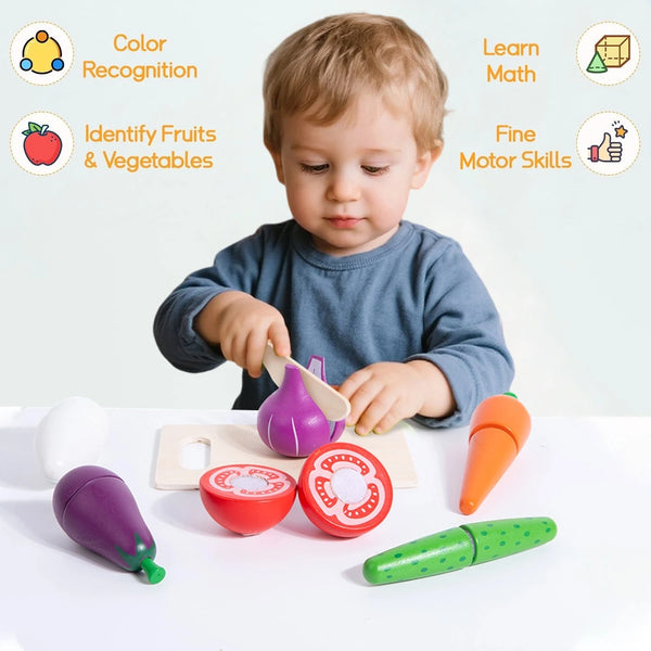 A toddler is interacting with a wooden fruit and vegetable cutting play set, demonstrating color recognition and fine motor s