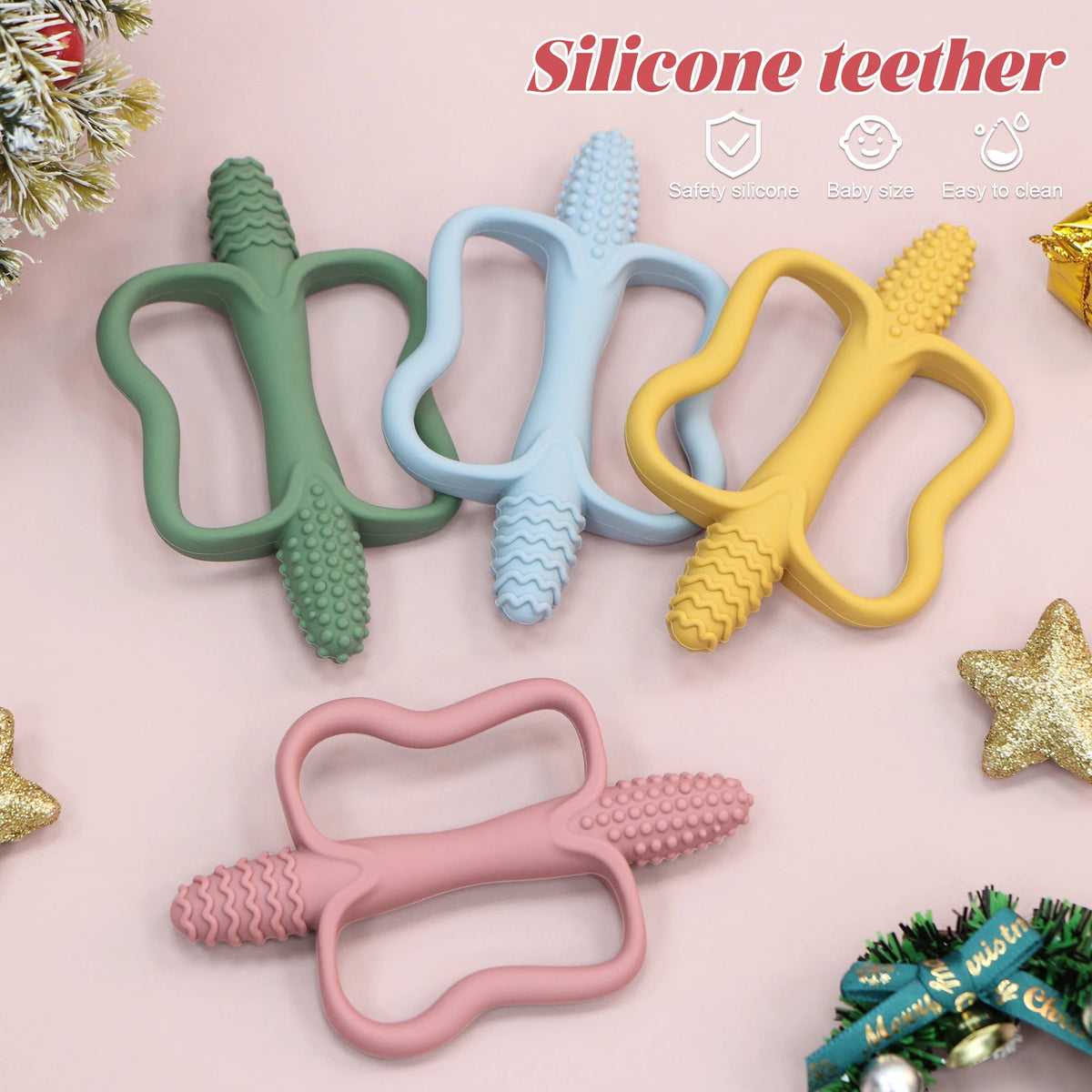 Three silicone teethers in green, blue, and yellow are displayed on a pink background.