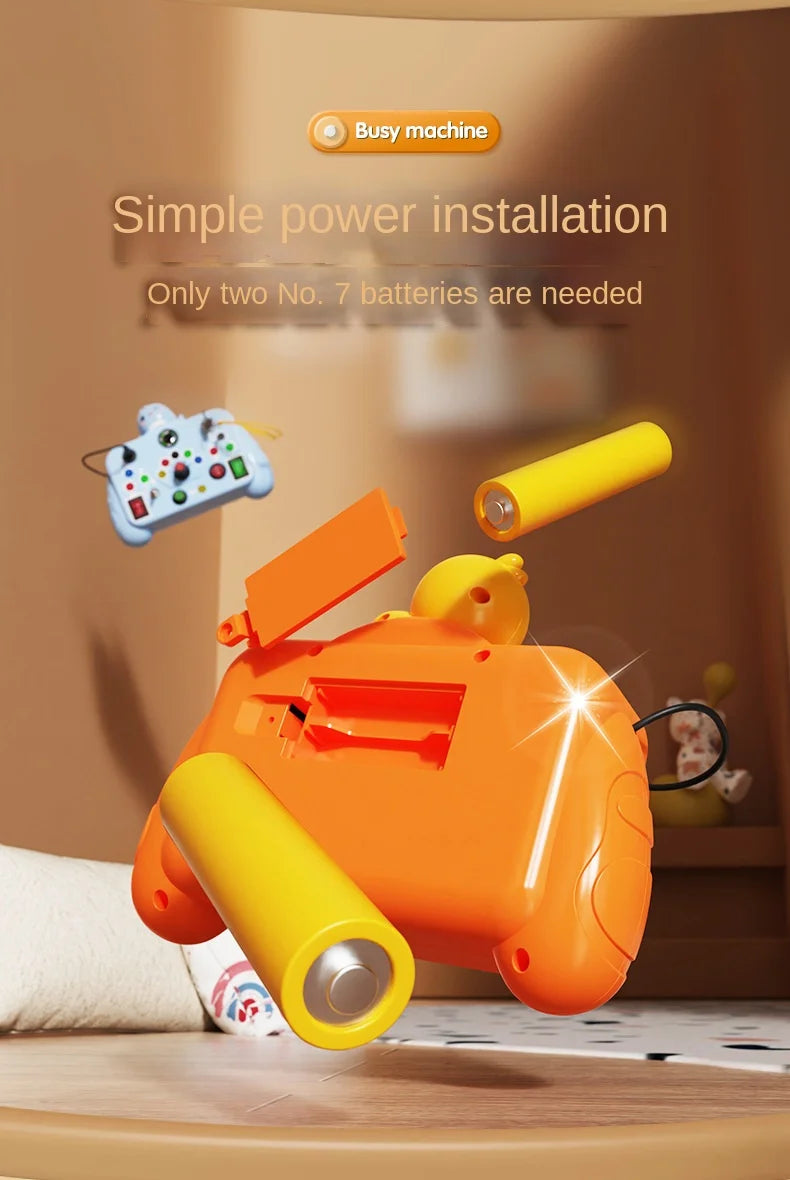 An orange Montessori busy machine with yellow components and an LED light, shown in a close-up on a wooden surface.