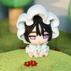 A white blind box mini figure collectible with black hair and purple eyes wearing a fluffy white hood.
